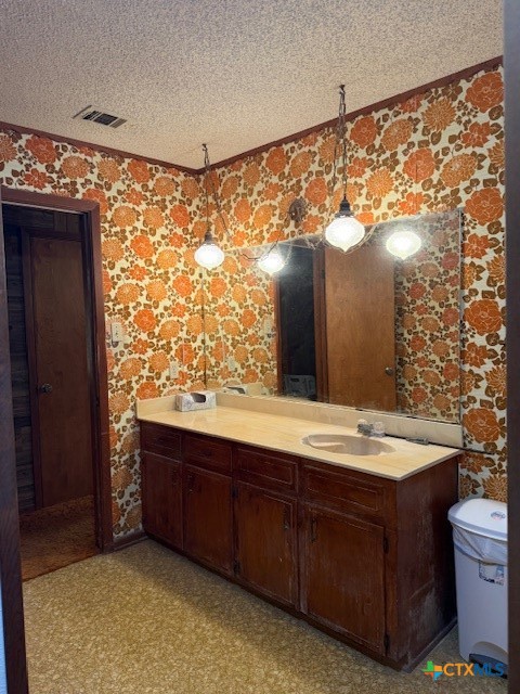 215 Price Street Yoakum, TX 77995 - Photo 18 of 20 a bathroom with a sink and mirror