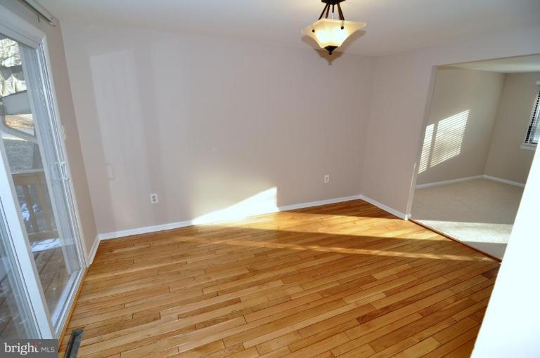 7914 Orange Plank Road Springfield, VA 22153 - Photo 2 of 9 a view of empty room with wooden floor