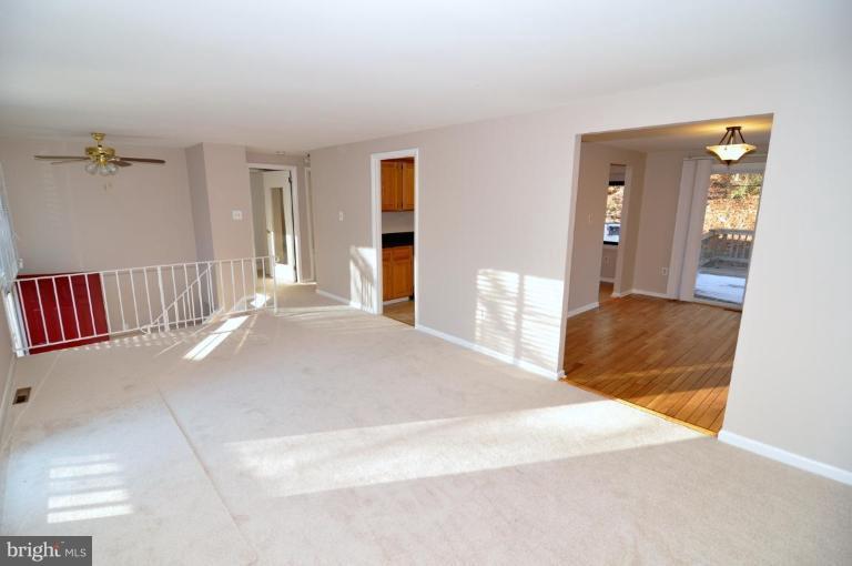 7914 Orange Plank Road Springfield, VA 22153 - Photo 3 of 9 a bedroom with a large bed and dresser