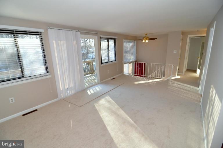 7914 Orange Plank Road Springfield, VA 22153 - Photo 7 of 9 a view of an empty room with glass door and windows