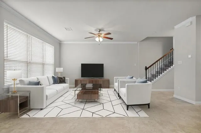 a living room with furniture a table and a chandelier