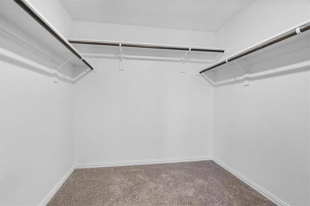 3300 Becker Drive Denton, TX 76207 - Photo 17 of 28 a view of a room with racks on the wall