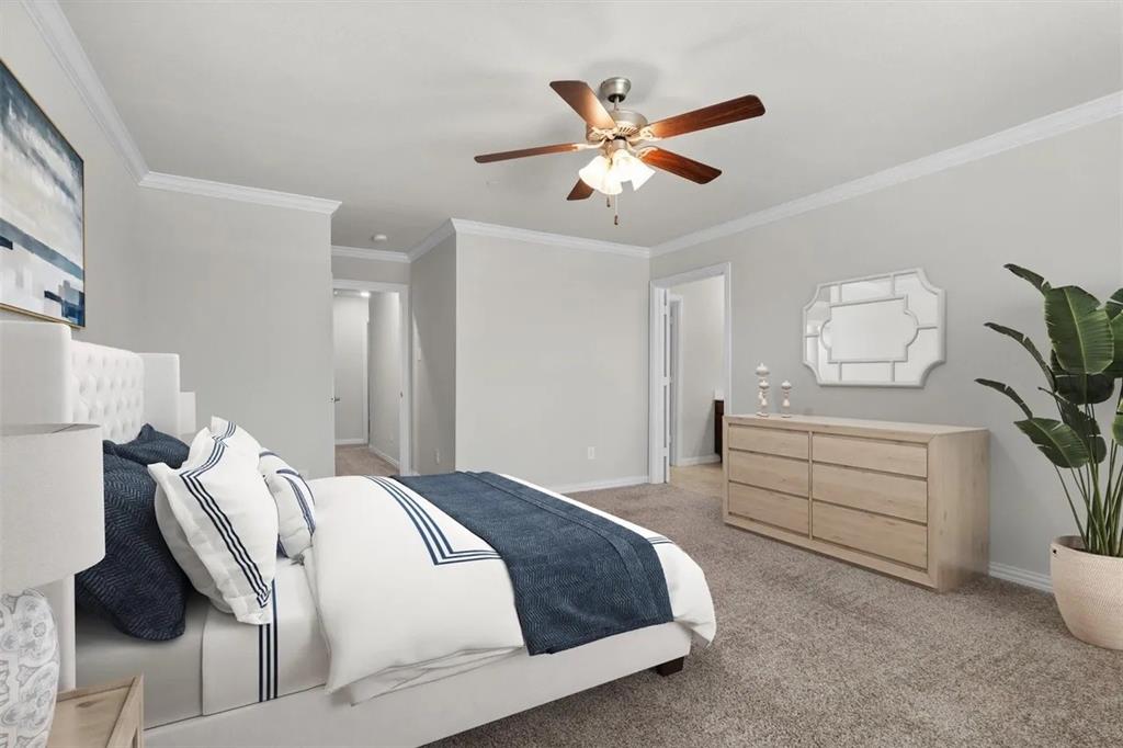 3300 Becker Drive Denton, TX 76207 - Photo 19 of 28 a bedroom with a bed and a chandelier