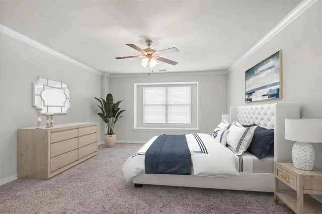 a spacious bedroom with a bed and a chandelier