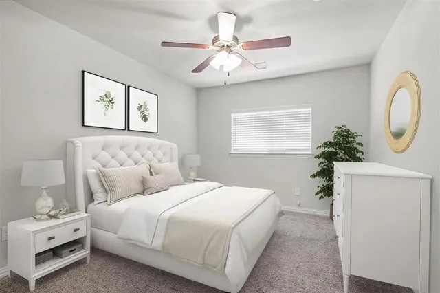 a bedroom with bed and a chandelier