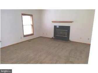 a open hall with a fireplace