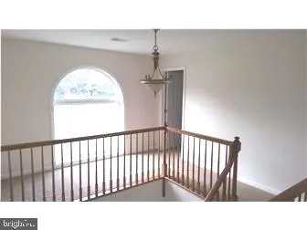 a black and white photo of a balcony