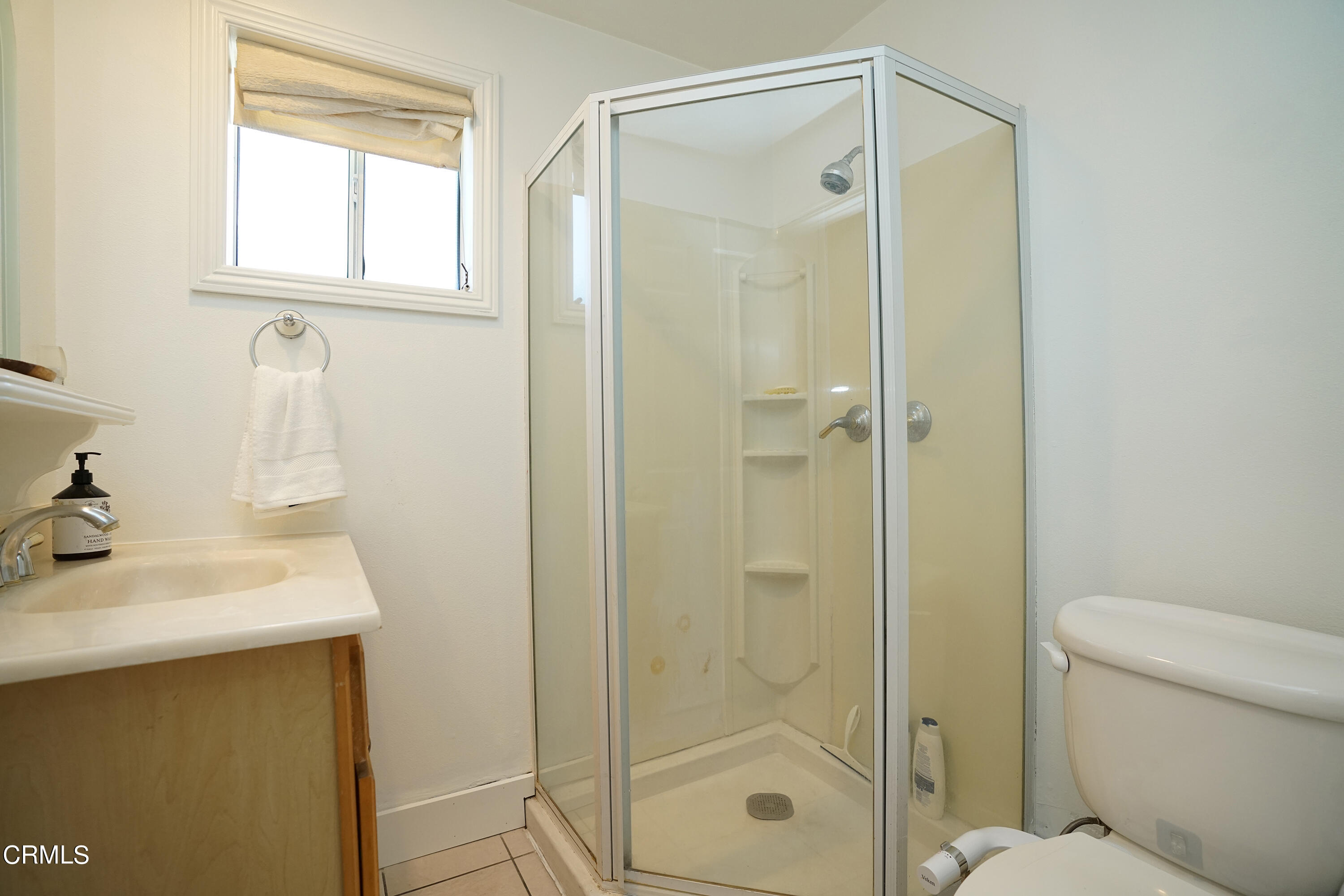1739 Brigden Road Pasadena, CA 91104 - Photo 15 of 33 a bathroom with a shower a sink and a toilet