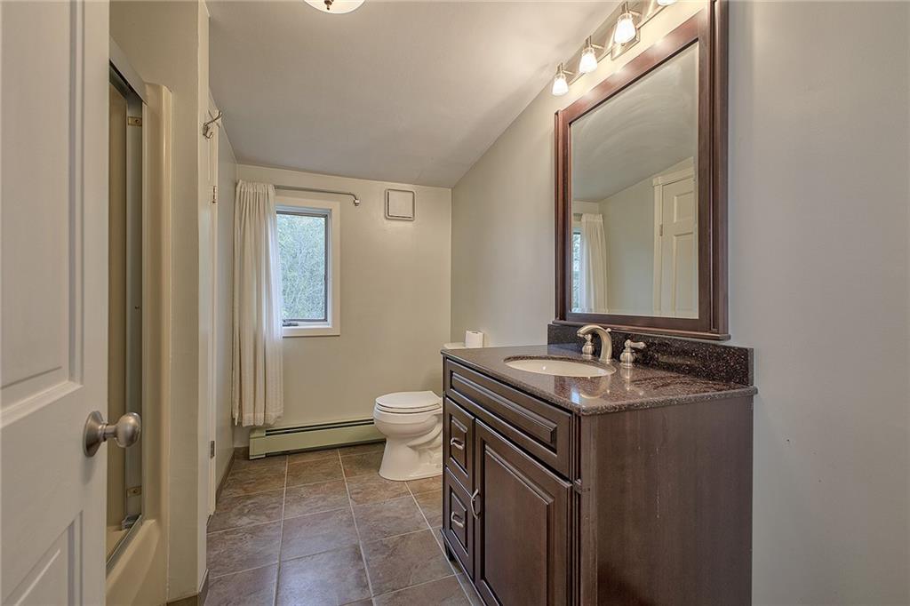 18 Rhea Road Indiana, PA 15701 - Photo 16 of 39 a bathroom with a granite countertop sink and a mirror