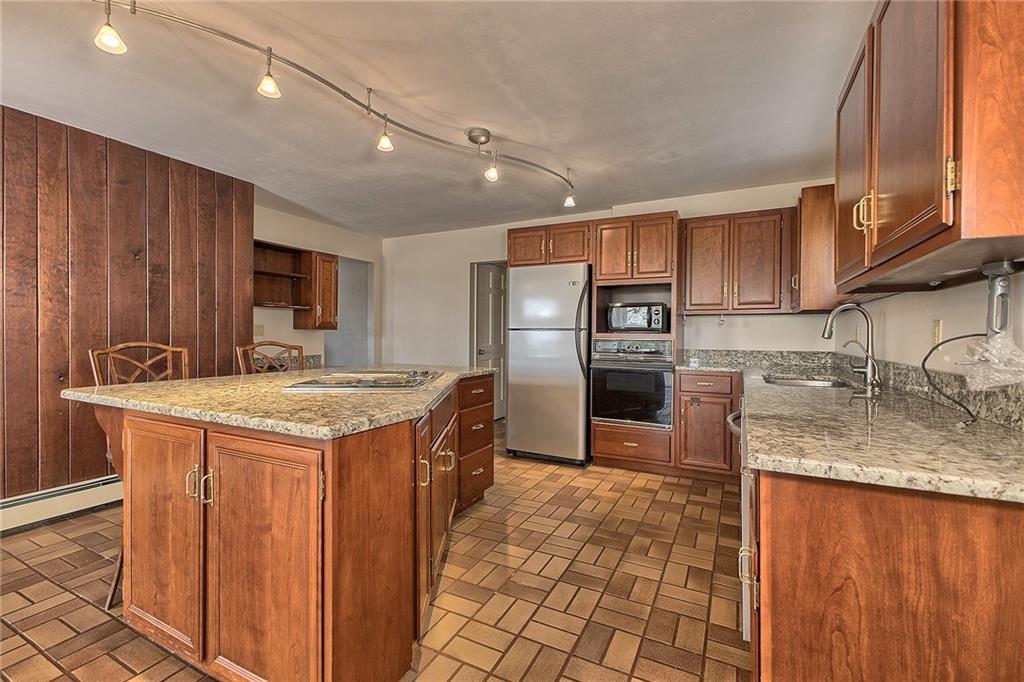18 Rhea Road Indiana, PA 15701 - Photo 6 of 39 a kitchen with stainless steel appliances granite countertop a sink a stove and a refrigerator