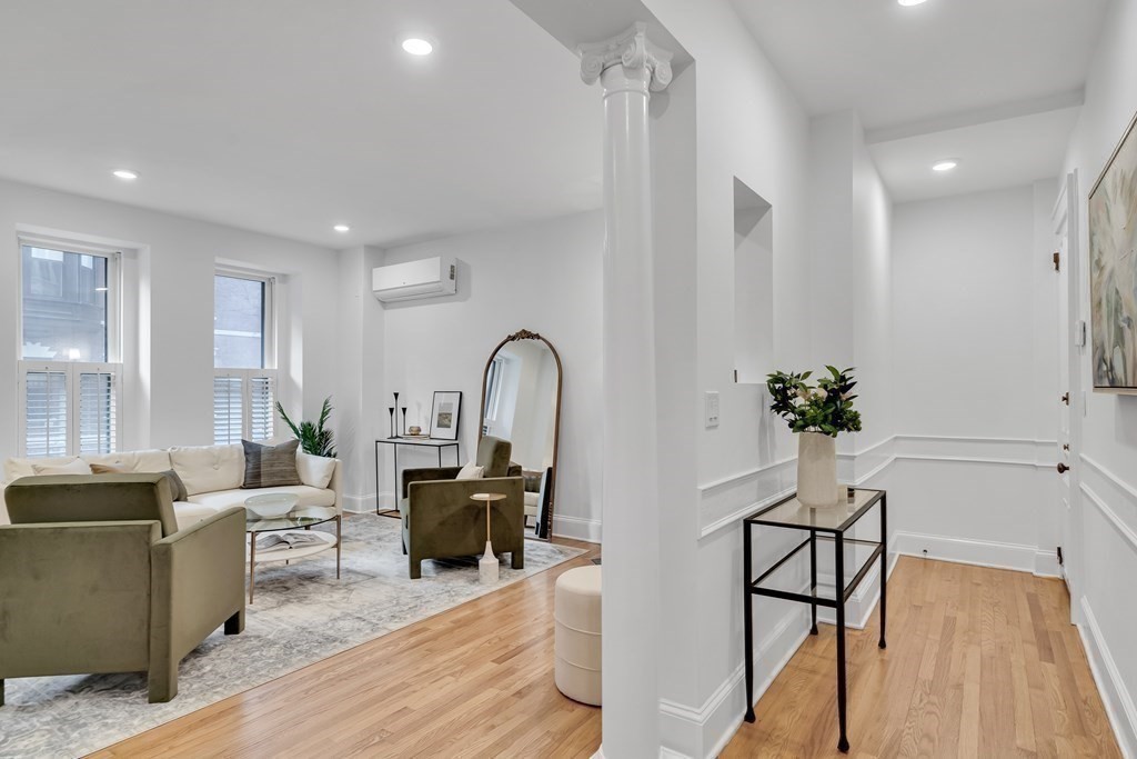 295 Beacon Street, Unit 2 Boston, MA 02116 - Photo 11 of 29 a living room with furniture a potted plant and open kitchen view