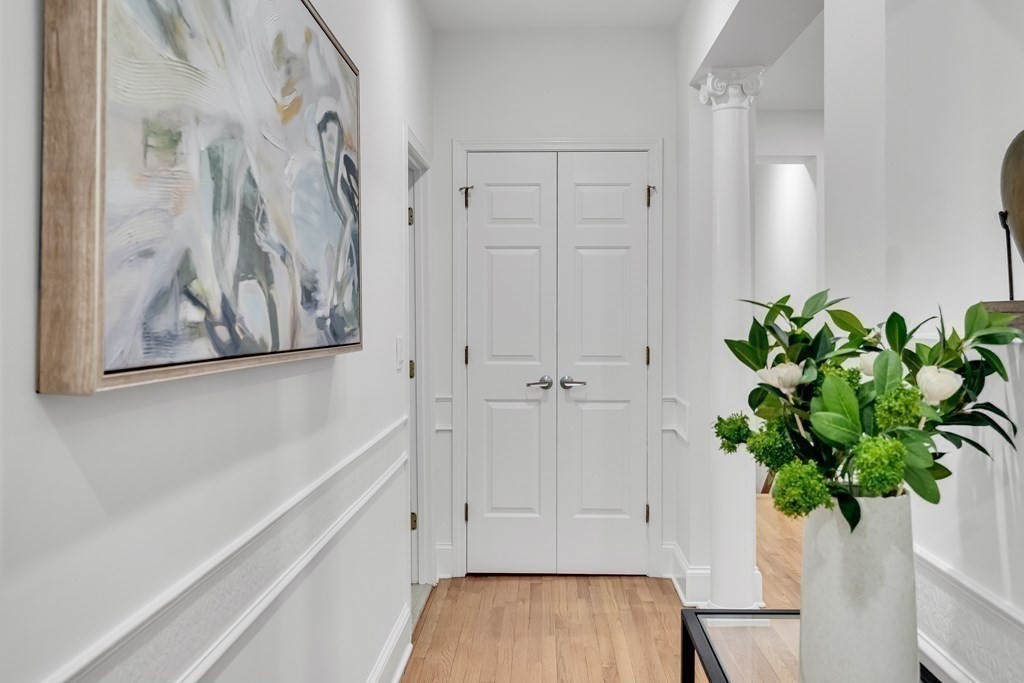 295 Beacon Street, Unit 2 Boston, MA 02116 - Photo 12 of 29 a view of hallway with window and flower pot