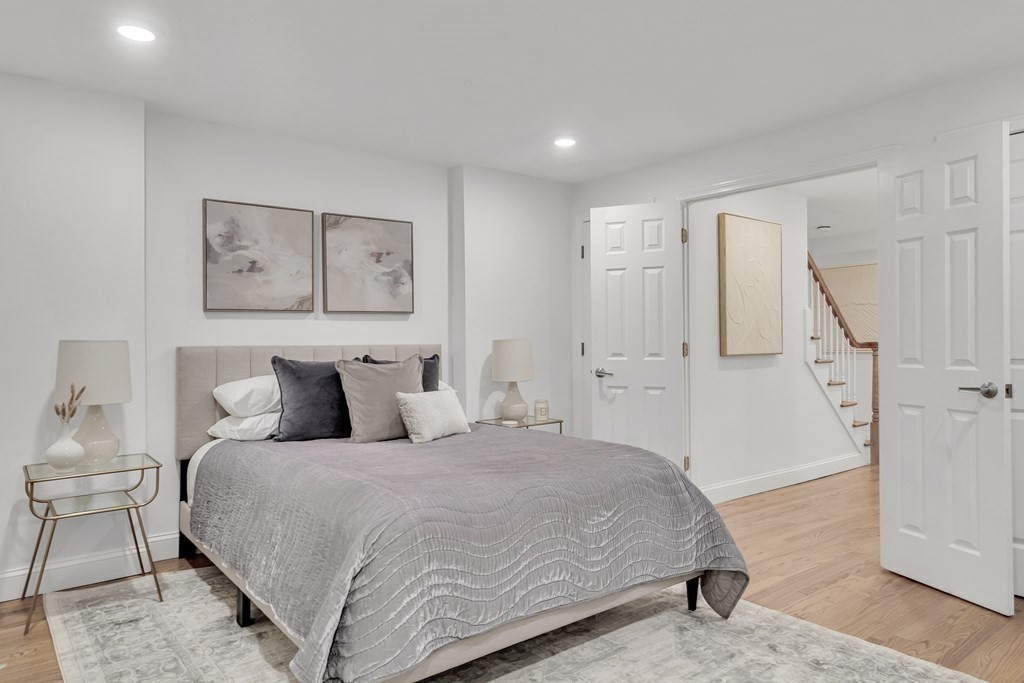 295 Beacon Street, Unit 2 Boston, MA 02116 - Photo 15 of 29 a bedroom with a large bed and a painting on the wall