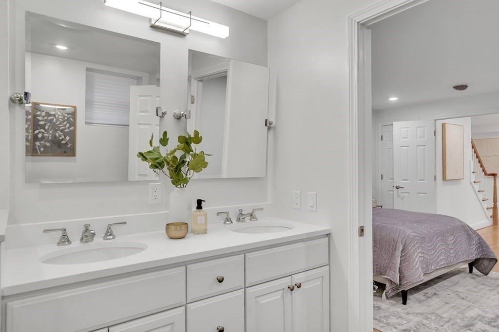 295 Beacon Street, Unit 2 Boston, MA 02116 - Photo 19 of 29 a en suite bathroom with double sink and a mirror