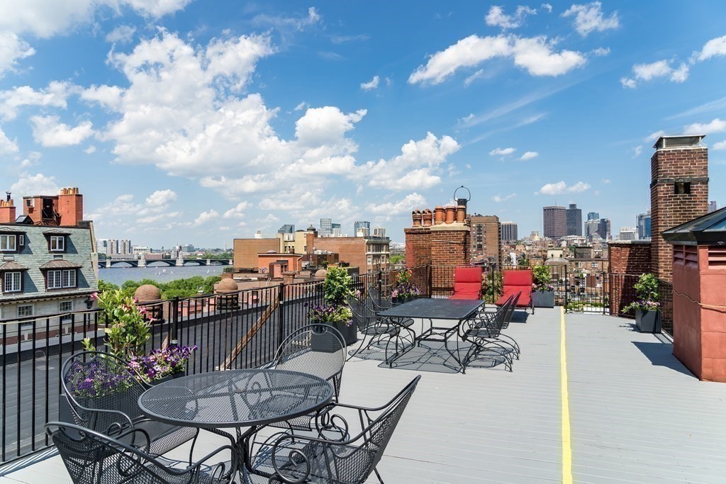 295 Beacon Street, Unit 2 Boston, MA 02116 - Photo 2 of 29 a view of a chairs and table in a terrace
