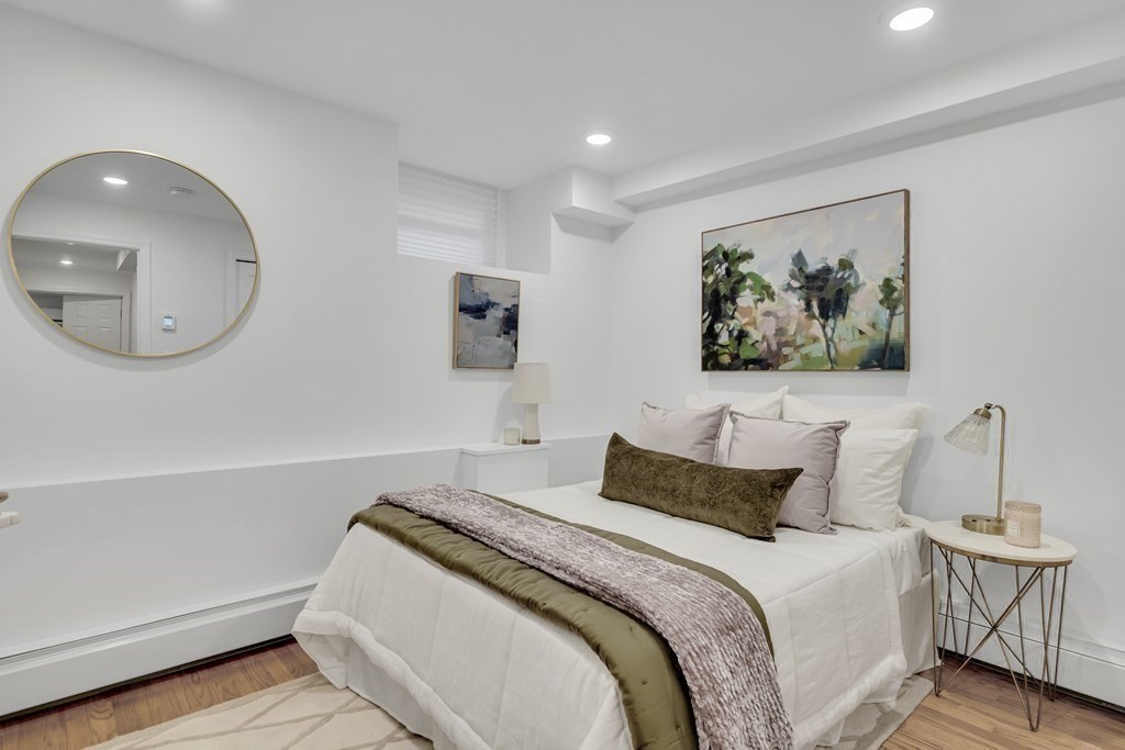 295 Beacon Street, Unit 2 Boston, MA 02116 - Photo 21 of 29 a bedroom with a bed and a painting on the wall