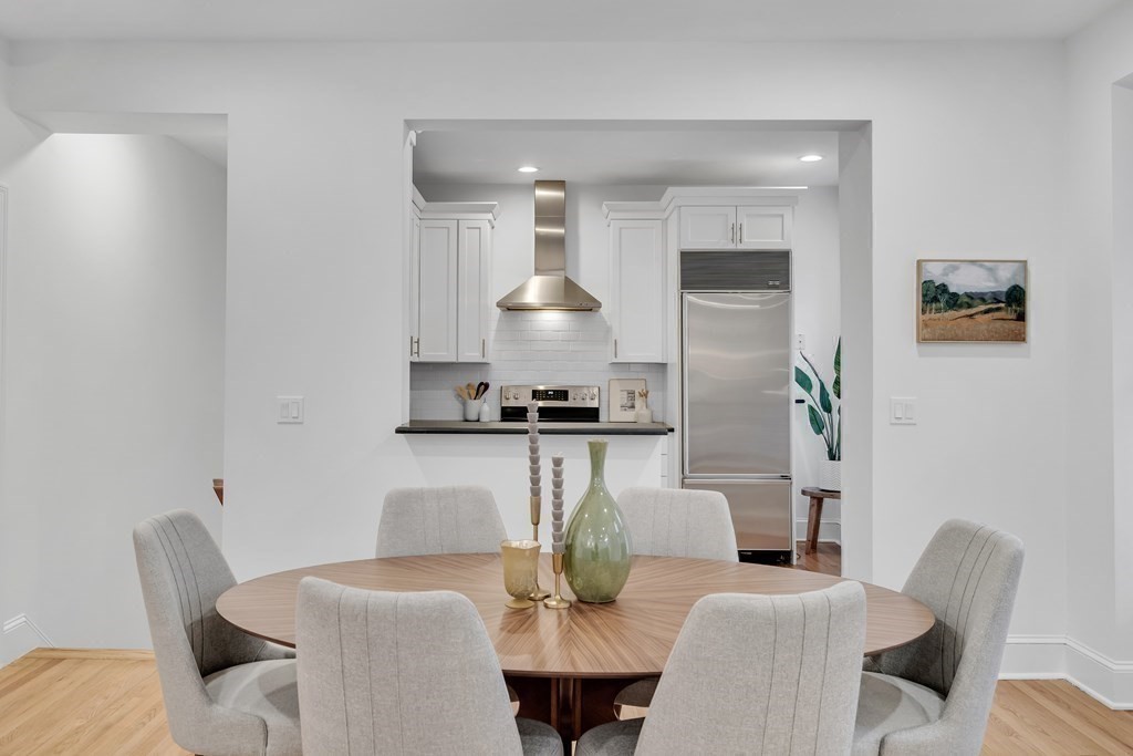 295 Beacon Street, Unit 2 Boston, MA 02116 - Photo 4 of 29 a living room with furniture a table and kitchen view