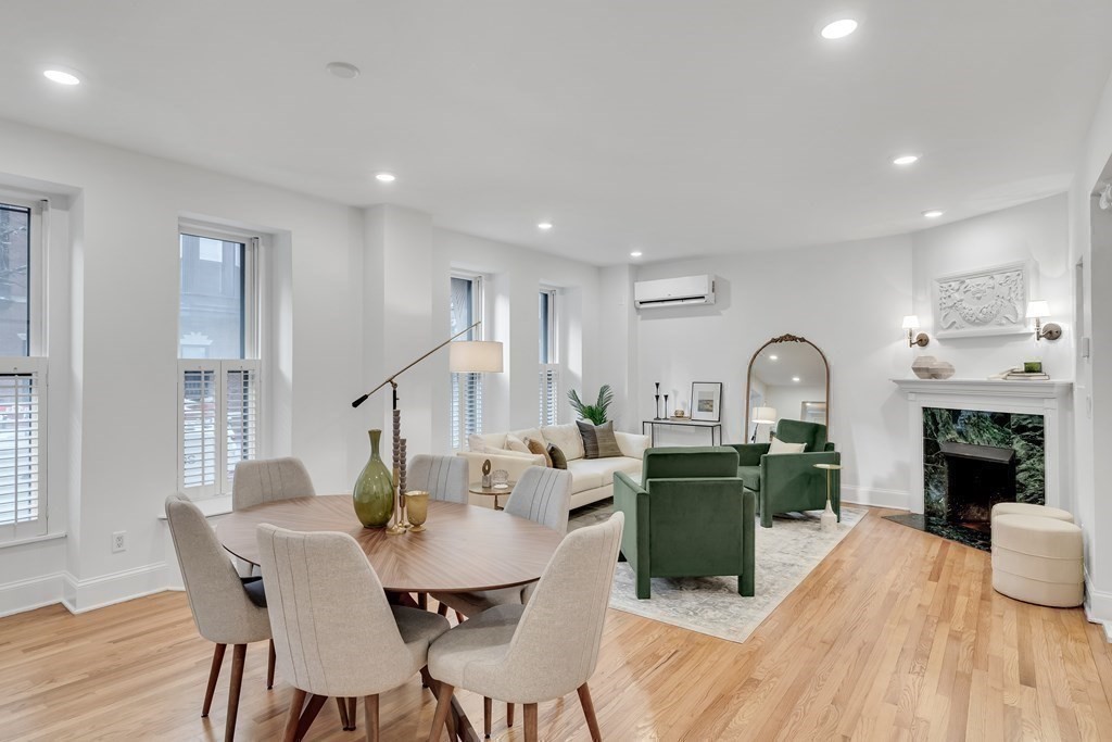 295 Beacon Street, Unit 2 Boston, MA 02116 - Photo 7 of 29 a living room with fireplace furniture and a wooden floor