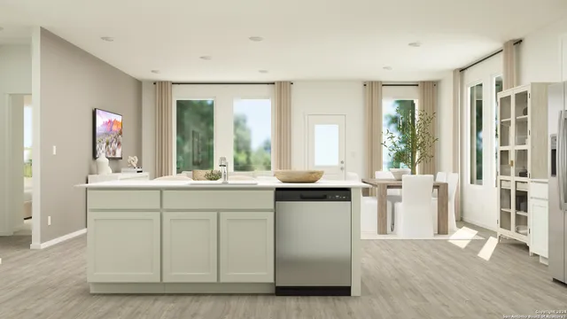 a kitchen with sink and cabinets