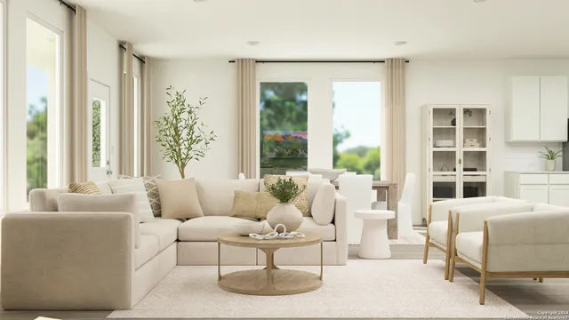 a living room with furniture and large windows