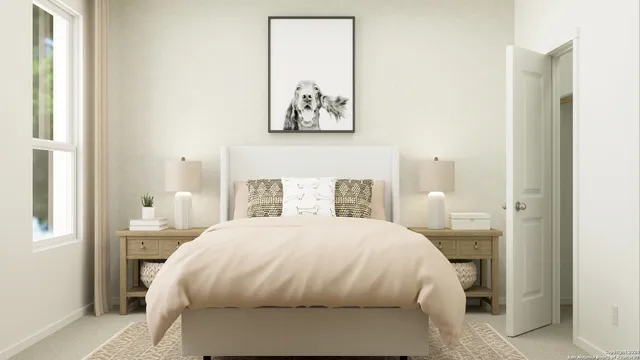 a bedroom with a bed and a painting on the wall