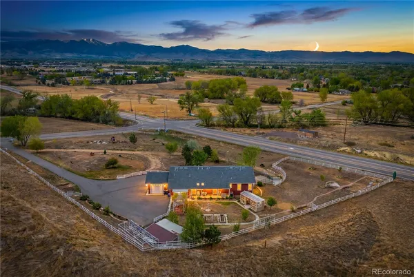 an aerial view of a house with a swimming pool