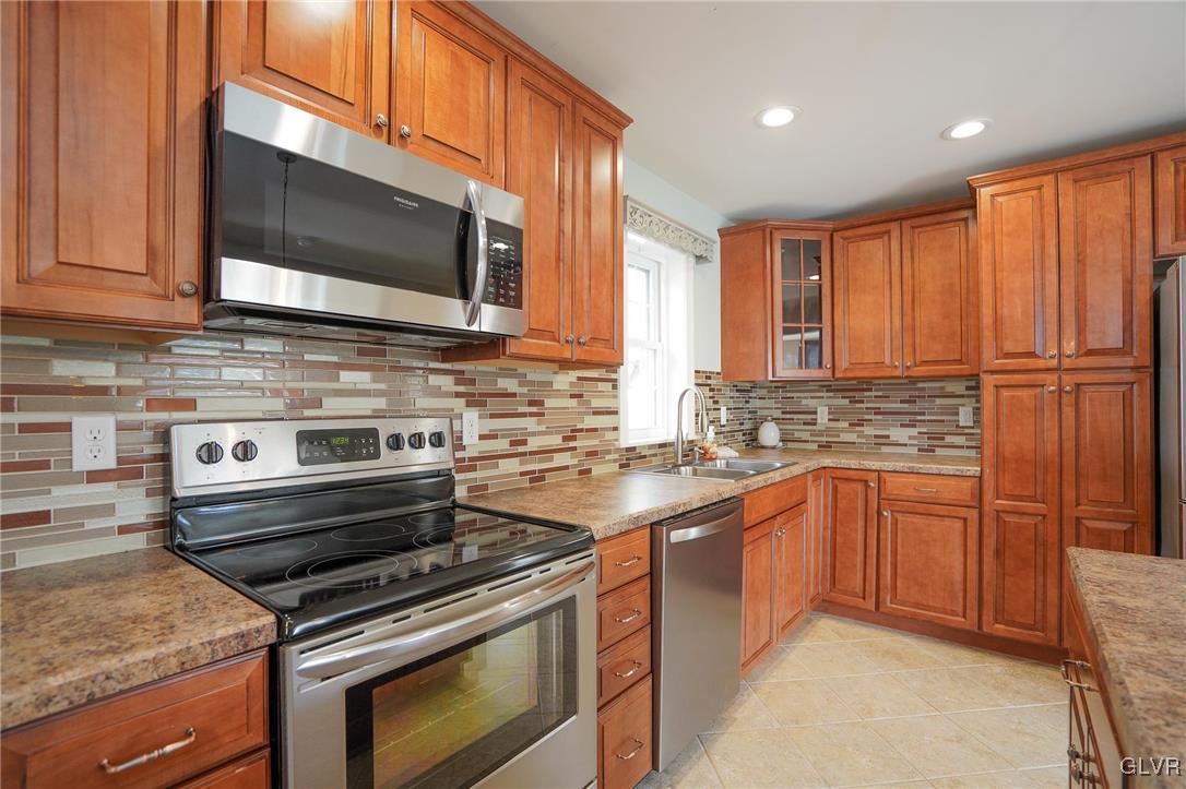 259 Owl Creek Road Tamaqua, PA 18252 - Photo 13 of 50 a kitchen with stainless steel appliances a stove sink and microwave