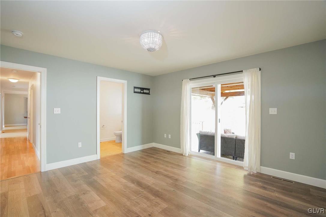 259 Owl Creek Road Tamaqua, PA 18252 - Photo 26 of 50 a view of an empty room with wooden floor and a window