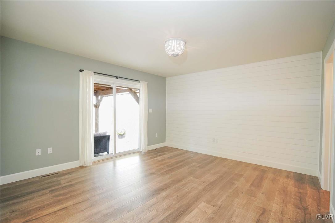 259 Owl Creek Road Tamaqua, PA 18252 - Photo 27 of 50 a view of an empty room with wooden floor and a window