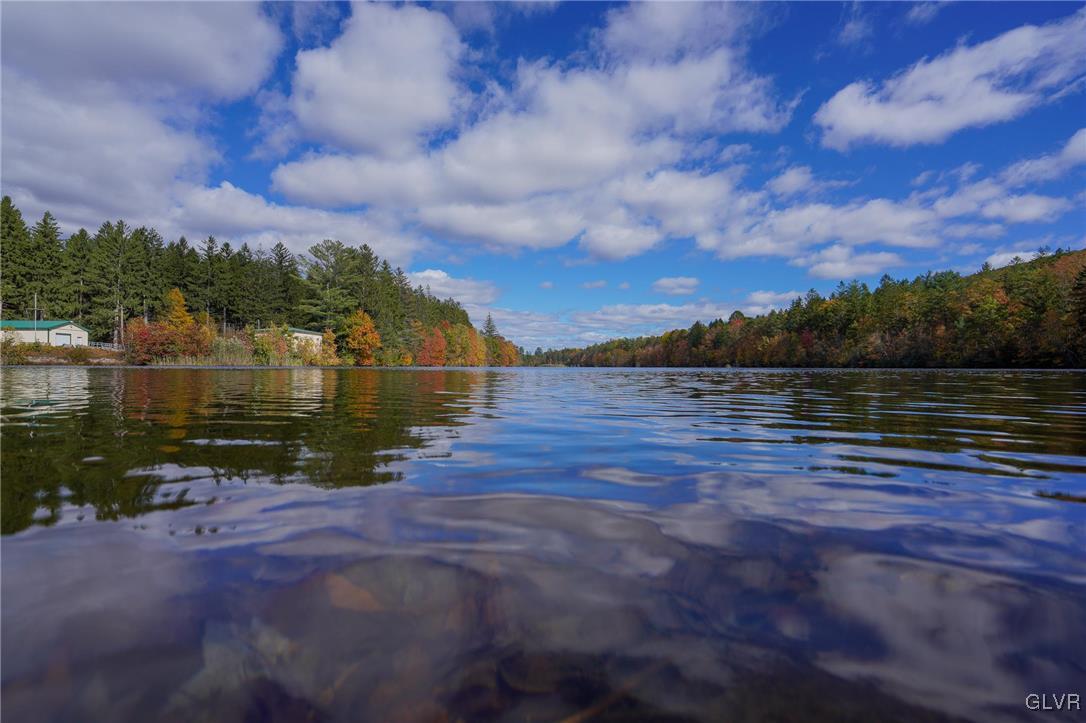 259 Owl Creek Road Tamaqua, PA 18252 - Photo 48 of 50 a view of a lake with houses in the back