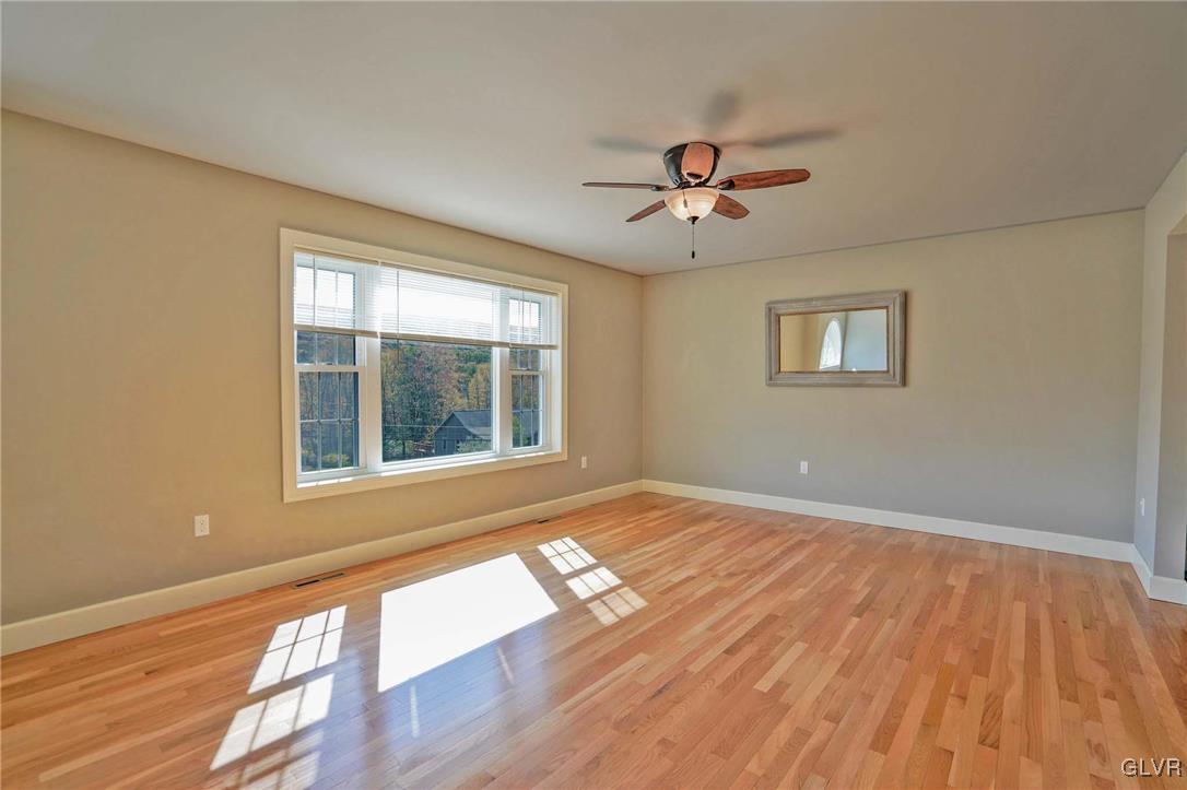 259 Owl Creek Road Tamaqua, PA 18252 - Photo 7 of 50 a view of an empty room with a window and wooden floor