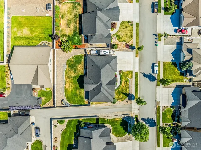 an aerial view of residential houses with outdoor space