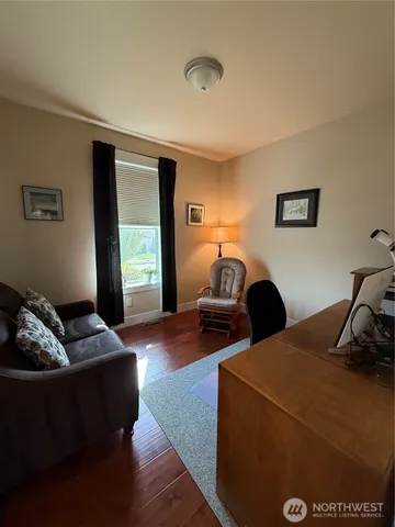 a bathroom with a tub a sink and a large mirror