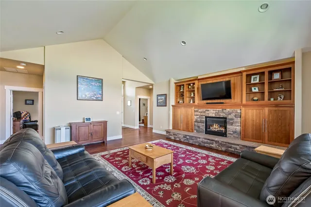 a dining room with furniture window and wooden floor