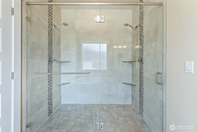 a view of a hallway with wooden floor and a living room