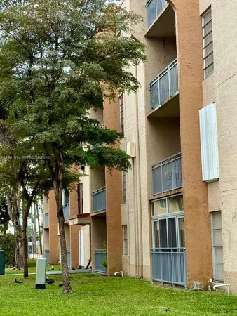 a view of house with yard