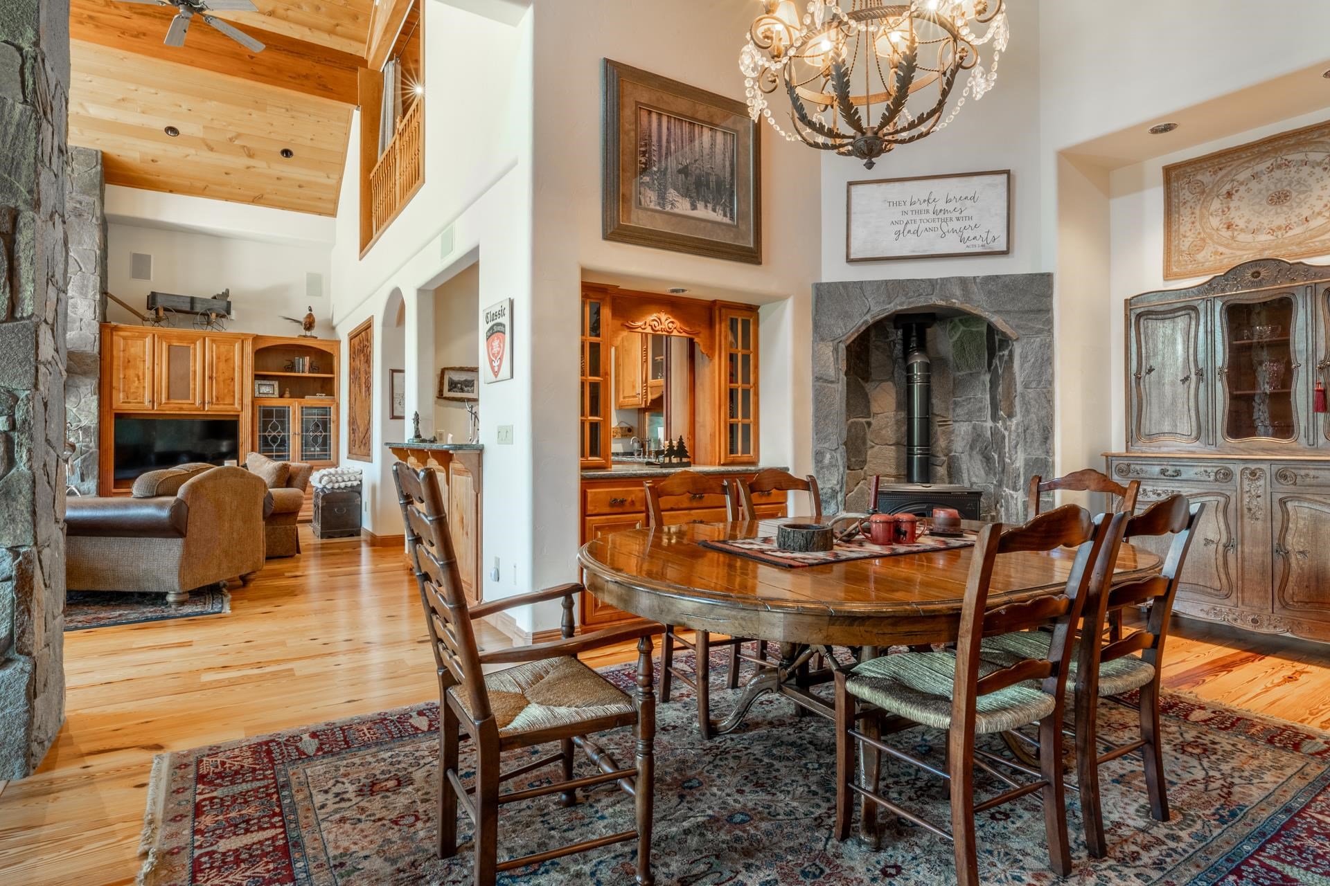 45 Skyline Road June Lake, CA 93529 - Photo 16 of 58 a view of a dining room with furniture a chandelier and wooden floor