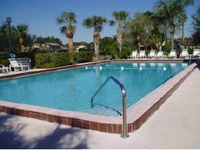 823 Northeast Brae, Unit 5 Palm Bay, FL 32905 - Photo 4 of 4 a view of a swimming pool with a patio