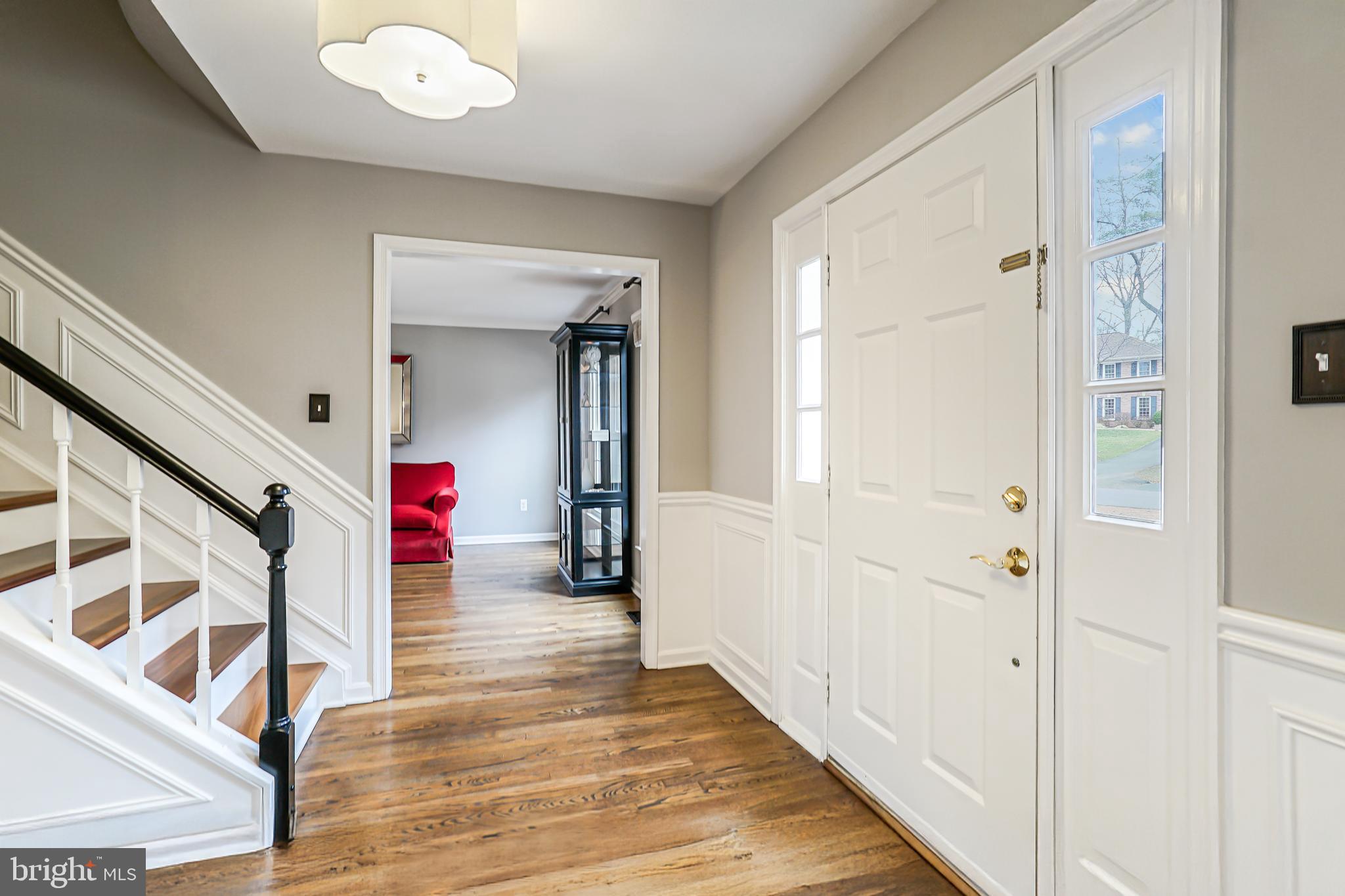 3416 Valewood Drive Oakton, VA 22124 - Photo 11 of 57 a view of a hallway with wooden floor and staircase