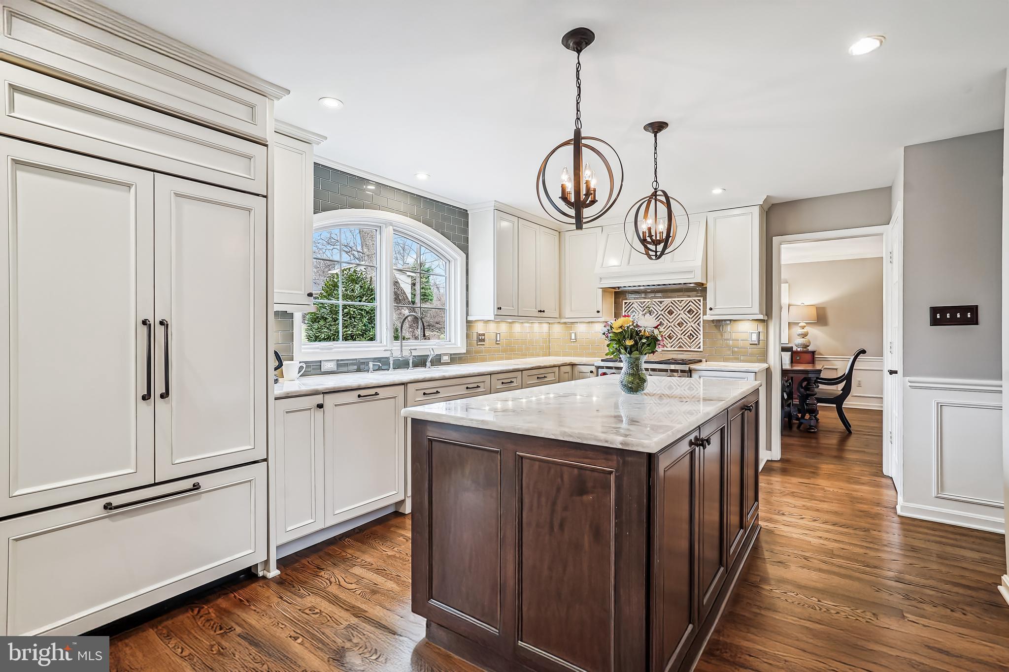 3416 Valewood Drive Oakton, VA 22124 - Photo 2 of 57 a open kitchen with stainless steel appliances granite countertop stove a refrigerator and a kitchen island with wooden floor