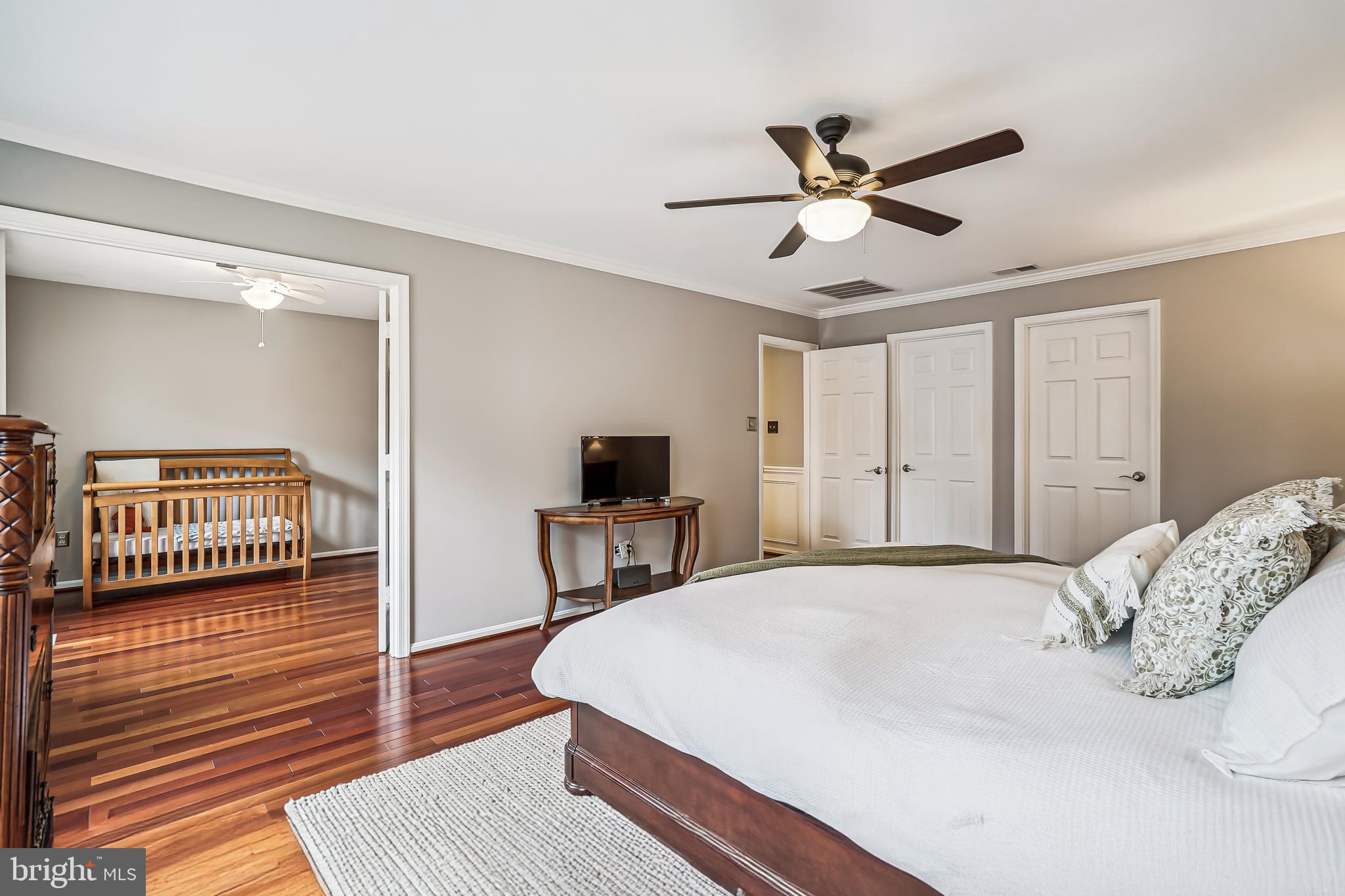 3416 Valewood Drive Oakton, VA 22124 - Photo 25 of 57 a bedroom with bed and a chandelier