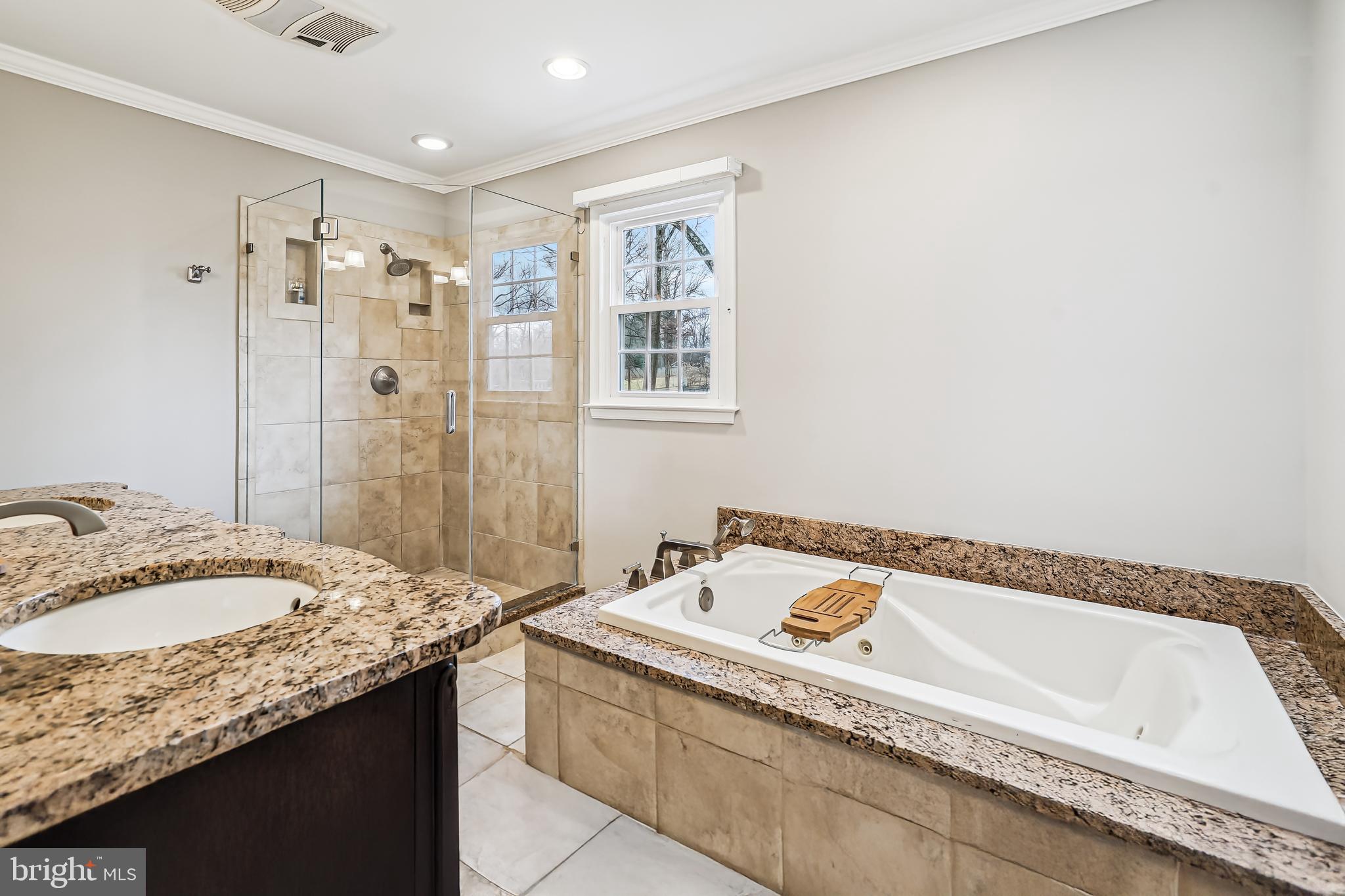 3416 Valewood Drive Oakton, VA 22124 - Photo 28 of 57 a bathroom with a granite countertop tub sink and mirror