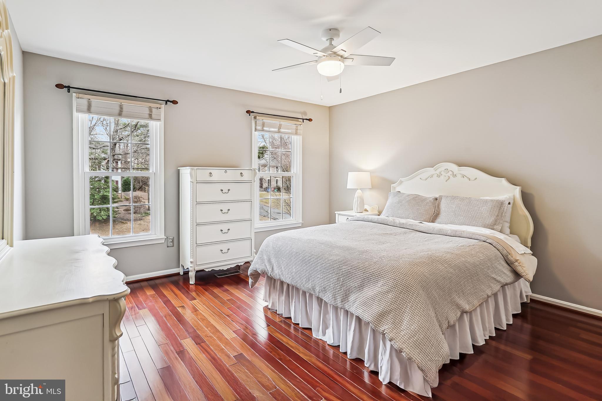 3416 Valewood Drive Oakton, VA 22124 - Photo 32 of 57 a bedroom with a bed a dresser and wooden floor