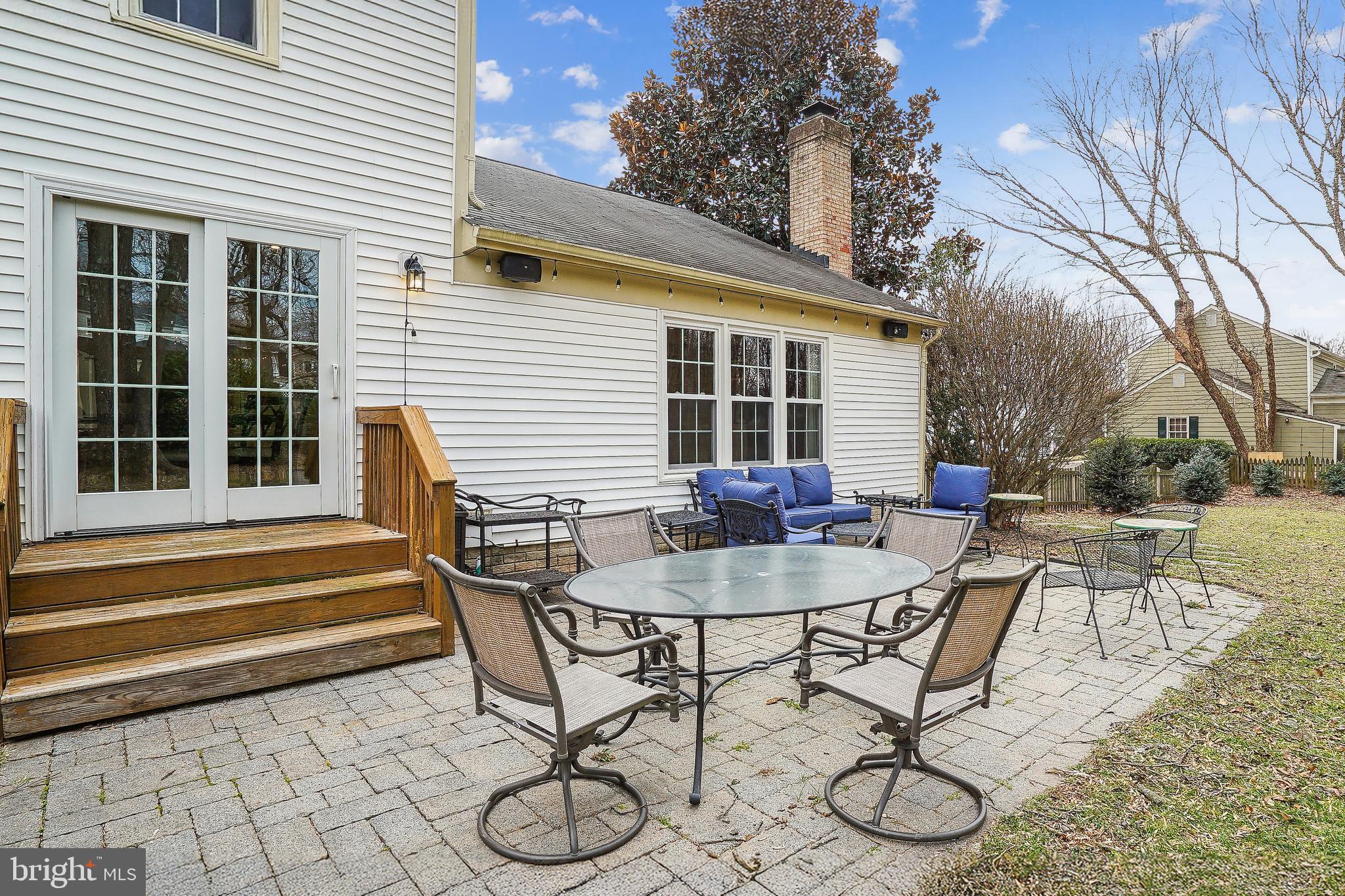 3416 Valewood Drive Oakton, VA 22124 - Photo 7 of 57 a backyard of a house with table and chairs