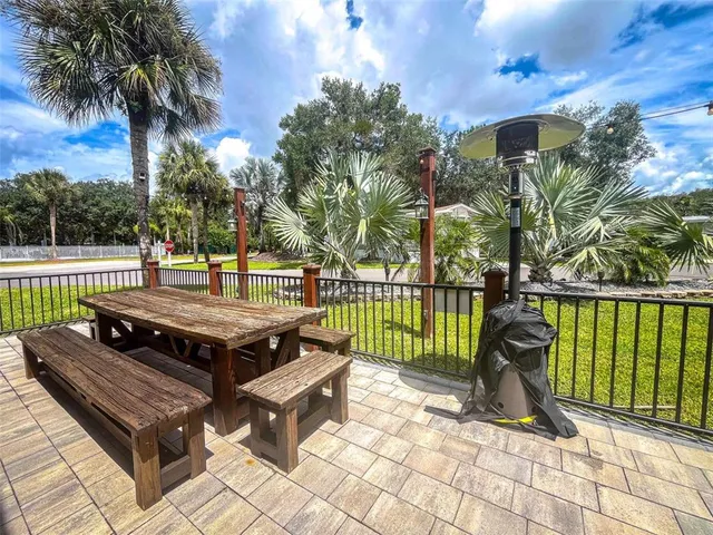 a view of a wooden deck with a yard