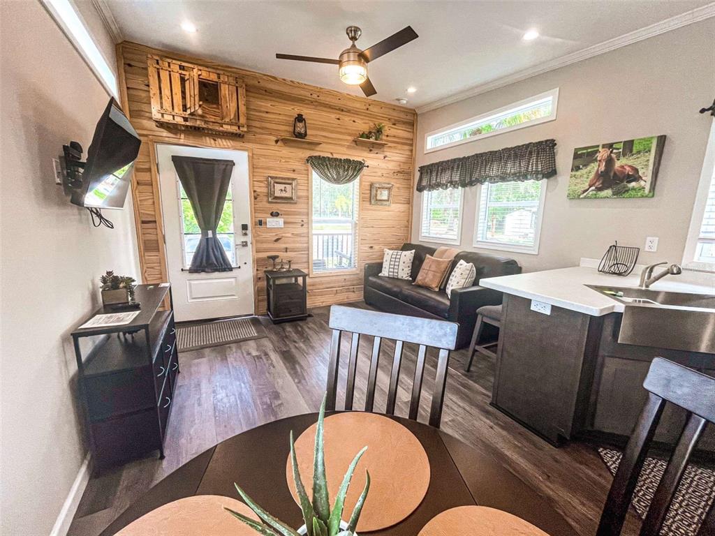 107 Long Hammock Drive River Ranch, FL 33867 - Photo 5 of 21 a living room with furniture chandelier and a window