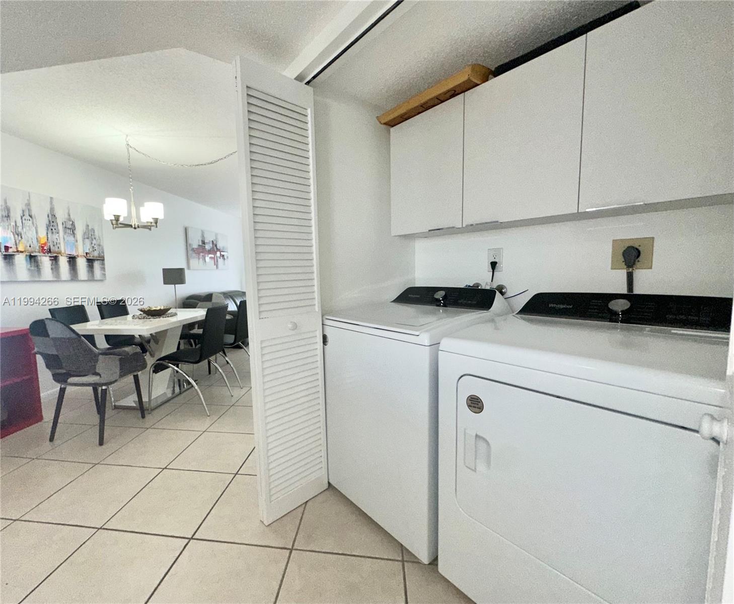 17801 North Bay Road, Unit 513 Sunny Isles Beach, FL 33160 - Photo 6 of 9 a kitchen with a sink and cabinets