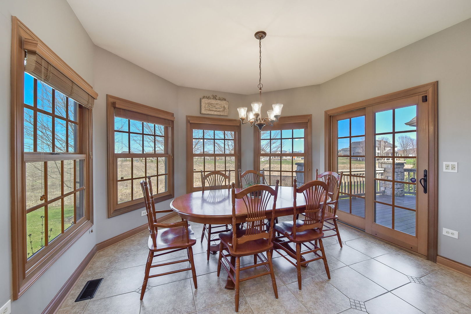 1737 Hunters Ridge Lane Sugar Grove, IL 60554 - Photo 17 of 50 a view of a dining room with furniture wooden floor and chandelier