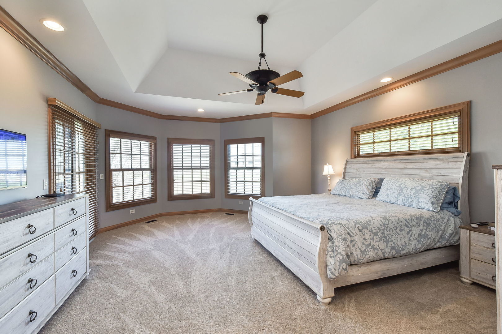 1737 Hunters Ridge Lane Sugar Grove, IL 60554 - Photo 18 of 50 a spacious bedroom with a large bed and a dresser
