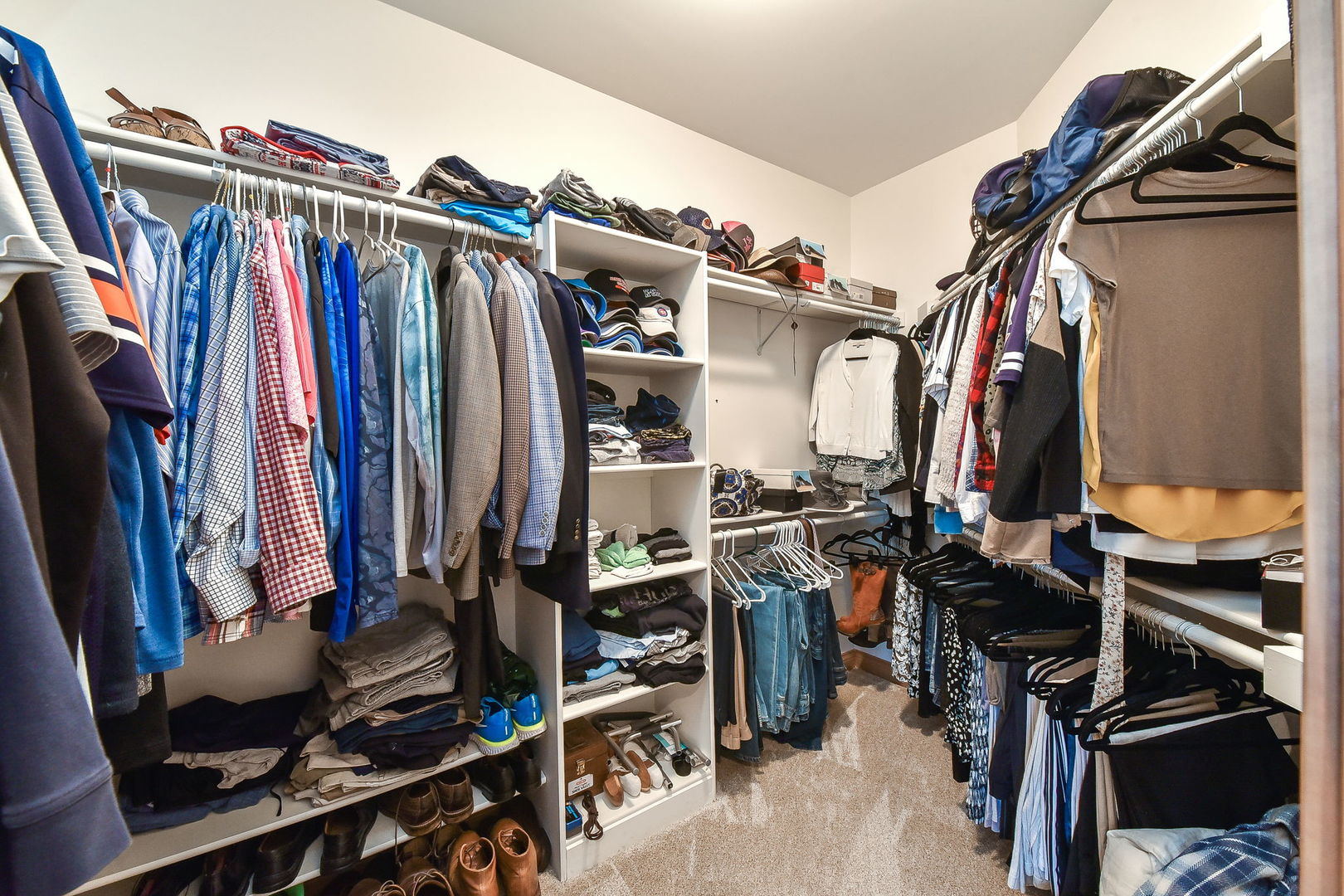 1737 Hunters Ridge Lane Sugar Grove, IL 60554 - Photo 22 of 50 a view of walk in closet with clothes and shoes